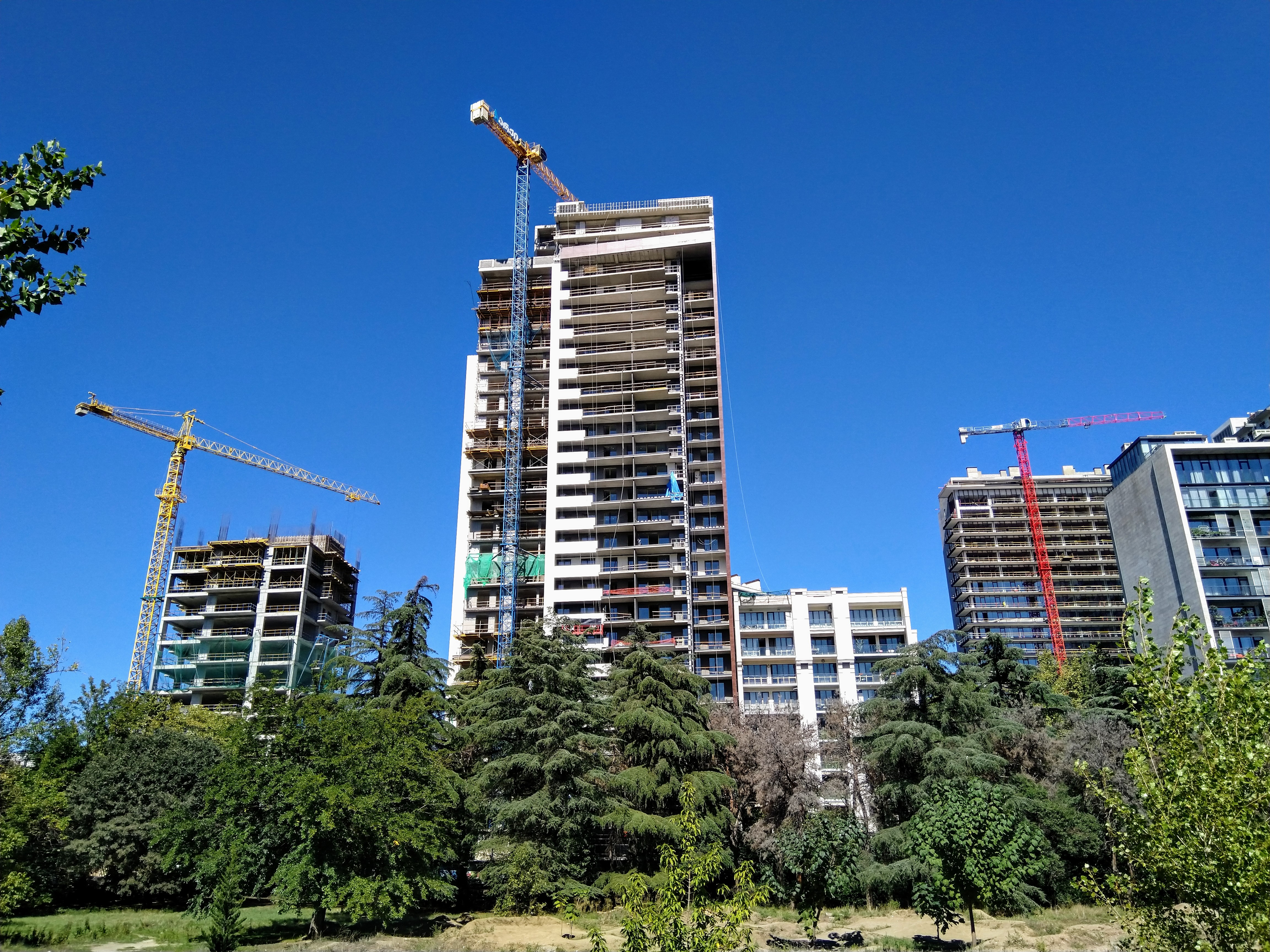 Residential high-rise buildings among green trees in Tbilisi, Georgia